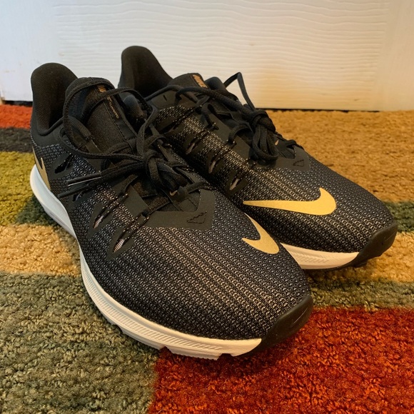 black and gold nike runners